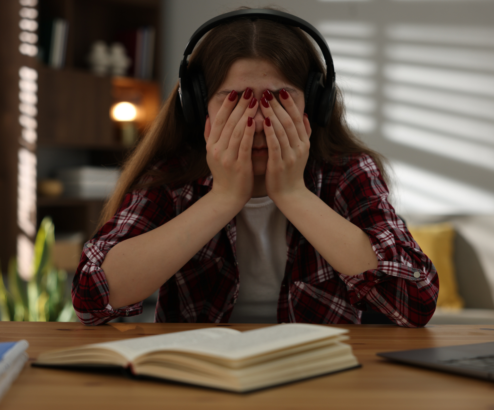 My child is panicking about GCSEs and doesn't feel prepared, anxious teen surrounded by GCSE books